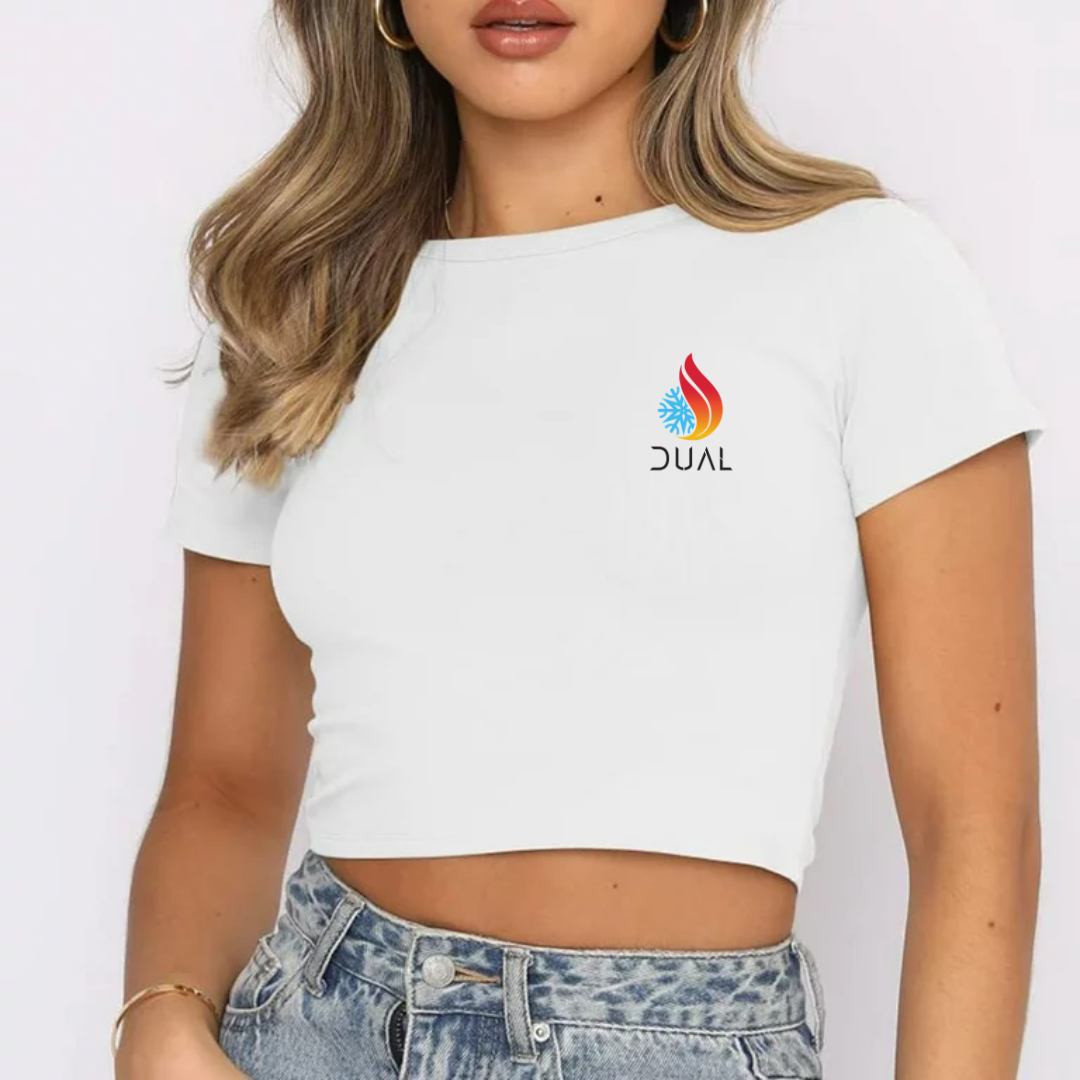 Person wearing a white crop top with a logo on a plain background