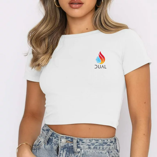 Person wearing a white crop top with a logo on a plain background