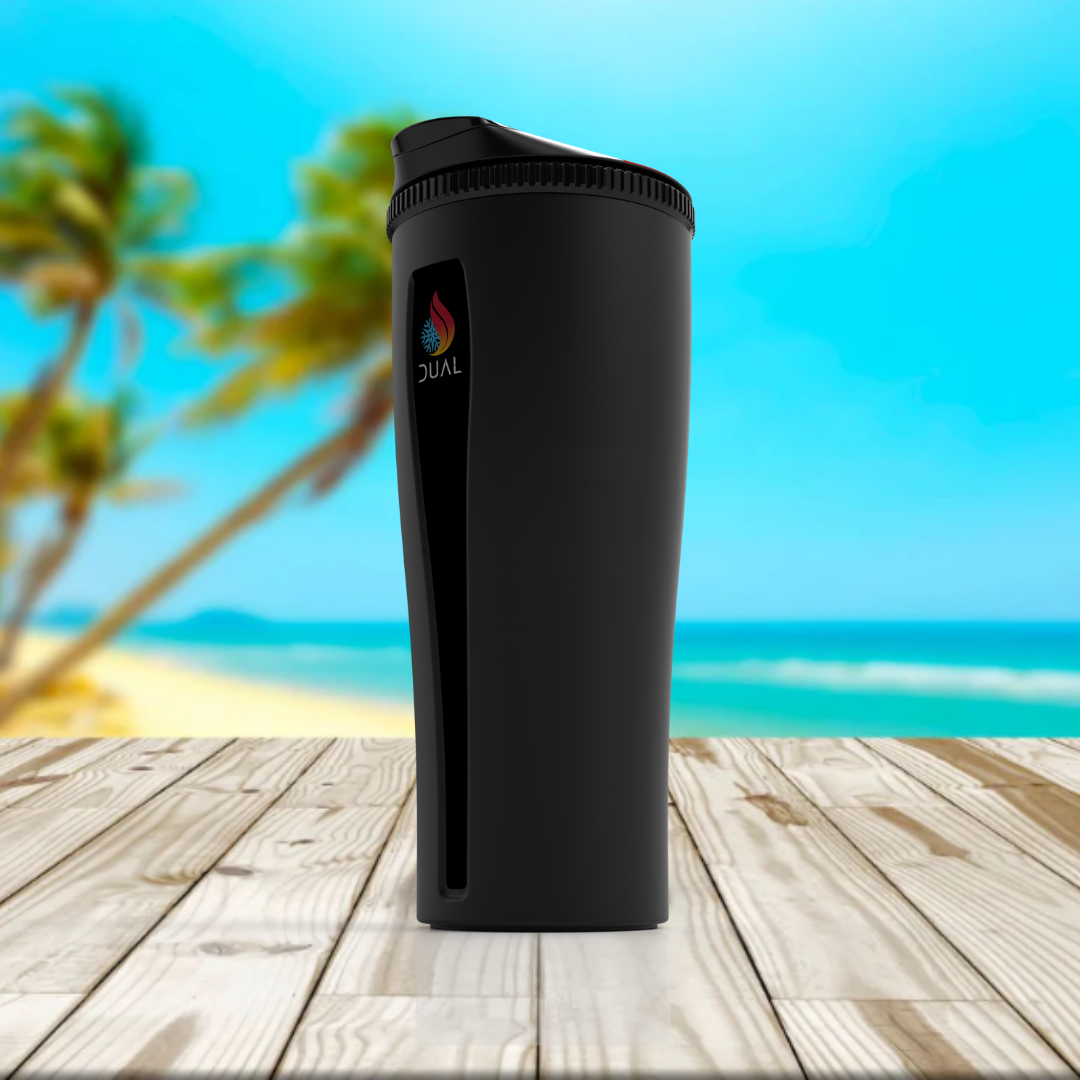 Dual Tumbler in Black Sand finish, featuring a sleek matte black design inspired by volcanic beaches, shown in a tropical coastal setting.”